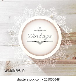 Vintage frame on a realistic wood texture , vector