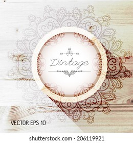 Vintage frame on a realistic wood texture , vector