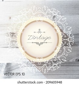 Vintage frame on a realistic wood texture , vector