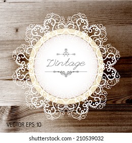 Vintage frame on a realistic wood texture , vector