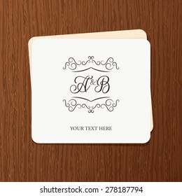 Vintage frame for weddings, invitations, greeting cards, menus, business identity. Elegant vector calligraphic card design on wood texture background.