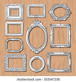 Vintage frames on wooden background. Old vector picture frames