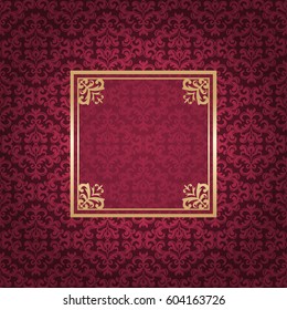 Vintage golden frame on colored ornamental luxury background
