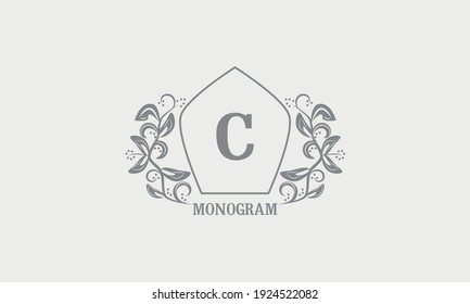 Vintage graceful floral monogram with initials С. Heraldic logo symbol with exclusive calligraphic design elements in gray tones. Business sign, identity for hotel, restaurant, jewelry.