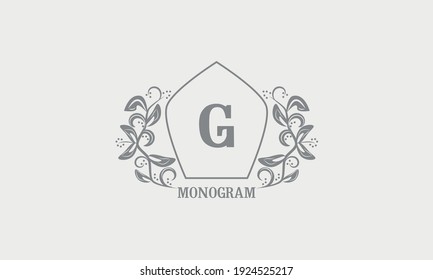 Vintage graceful floral monogram with initials G. Heraldic logo symbol with exclusive calligraphic design elements in gray tones. Business sign, identity for hotel, restaurant, jewelry.