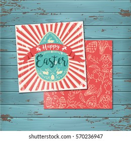 Vintage Greeting Easter cards on wooden background. Hand-drawn easter symbols. Lettering. Vector design