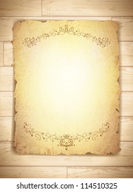 vintage grunge burnt paper at wooden background, copyspace