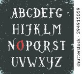 Vintage hand drawn decorative serif alphabet on blackboard