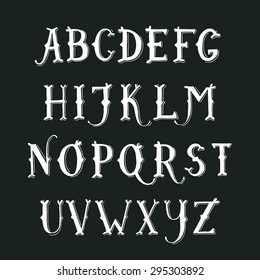 Vintage hand drawn decorative serif alphabet on blackboard