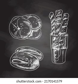 Vintage hand drawn sketch style bakery set. Bread and  buns. White sketch isolated on black chalkboard. Icons and elements for print, labels, packaging.