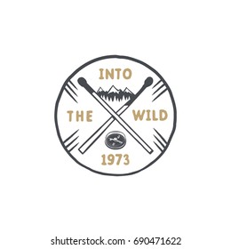 Vintage hand drawn survival badge and emblem. Hiking label. Outdoor inspirational logo. Typography retro style. Motivational quote - Into the wild. For prints, t shirts. Stock vector isolated