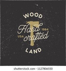 Vintage hand drawn woodworks logo and emblem. Wood land, hand crafted label. Typography lumberjack insignia with crossed axes and texts. Retro silhouette style. Stock vector illusration isolated.