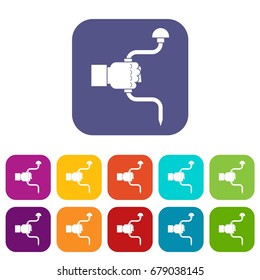 Vintage hand drill in man hand icons set vector illustration in flat style In colors red, blue, green and other