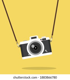 vintage hanging camera  on color  background concept