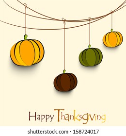 Vintage Happy Thanksgiving background with hanging pumpkins. 
