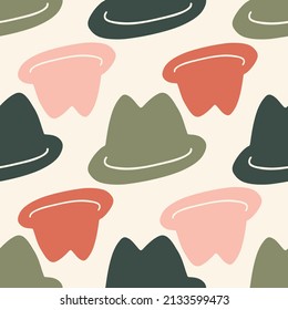 Vintage hats in different colours on sandy background. Classic hat seamless pattern.