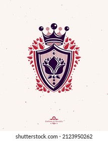 Vintage heraldic insignia made with monarch crown and lily flower royal symbol. Eco friendly product symbol, king quality theme illustration, protection shield.