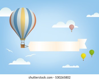 vintage hot air balloon with blank banner for message in the sky