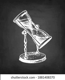 Vintage hourglass. Antique timer. Chalk sketch on blackboard. Hand drawn vector illustration. Retro style.