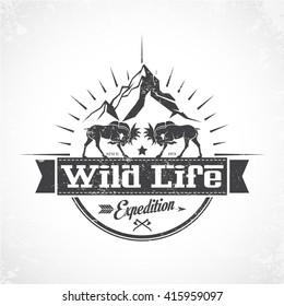 Vintage icon wildlife with moose and mountains in the background.