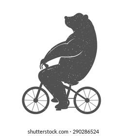 Vintage Illustration bear on a bike with Grunge effect. Funny bear ride a bicycle on a white background for posters and T-shirts.
