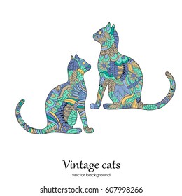 Vintage illustration with isolated ethnic patterned cats on the white background