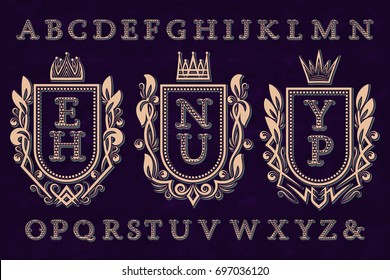 Vintage initial logos kit. Coat of arms frames, patterned letters, isolated alphabet.