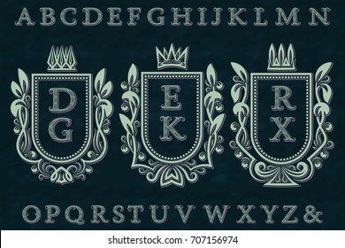 Vintage initial logos kit. Coat of arms frames, wavy stripe patterned letters, isolated alphabet.
