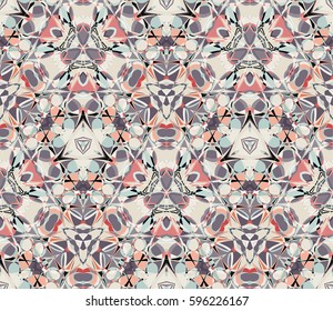 Vintage kaleidoscope seamless pattern. Composed of color abstract shapes. Useful as design element for texture and artistic compositions.