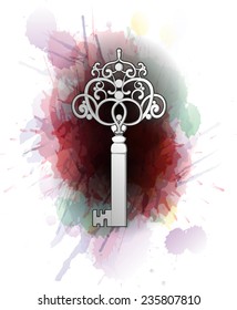 Vintage key in front of colorful splashes