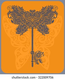 Vintage key in the patterns of the Baroque on orange