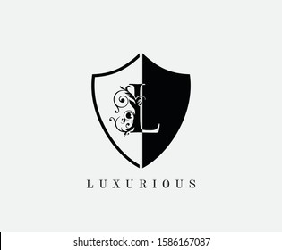 Vintage L Shield Letter Logo Icon. Black and White L With Classy Leaves Shape design perfect for fashion, Jewelry, Beauty Salon, Cosmetics, Spa, Hotel and Restaurant Logo. 