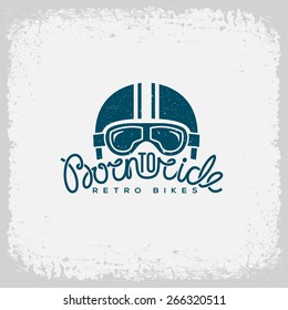 Vintage label with helmet, goggles and lettering text 'Born to Ride' on grunge background for t-shirt print, poster, emblem. Vector illustration.