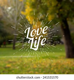 Vintage label for poster, banner, card, web design with the quote "Love life". Vector blurred background of a green park.