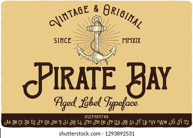 Vintage label typeface named Pirate Bay. Strong original logo font. Capital and small letters with numbers. Hand drawn illustration of anchor.