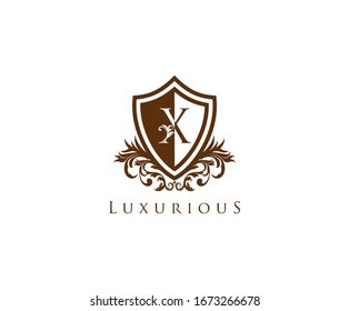 Vintage Letter X Logo. Shield X Letter Design Vector with shield shape and Floral Hand Drawn.