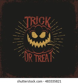 Vintage lettering with a Halloween pumpkin and the words "trick or treat" and sunburst on a dark background. Vector illustration. Grunge texture on separate layers.