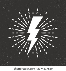 Vintage lightning bolt and sun rays on grunge background. Lightnings with sunburst effect. Thunderbolt, electric shock sign. Vector illustration