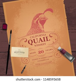 Vintage Logo with Bird Head. Tools for painting and old brown paper sheet on vintage wooden background. Top view.