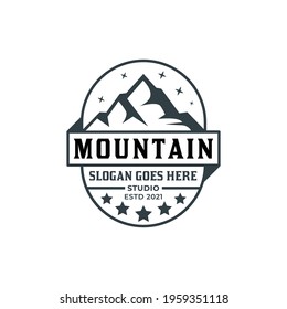 vintage logo of mountain badge studio for landscape photographer, adventure, climber illustration design
