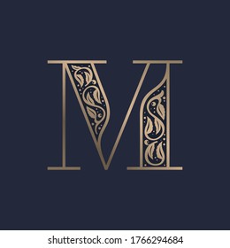 Vintage M letter logo with premium decoration. Classic line serif font. Vector icon perfect to use in any alcohol labels, glamour posters, luxury identity, etc.