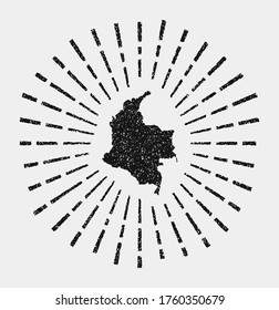 Vintage map of Colombia. Grunge sunburst around the country. Black Colombia shape with sun rays on white background. Vector illustration.