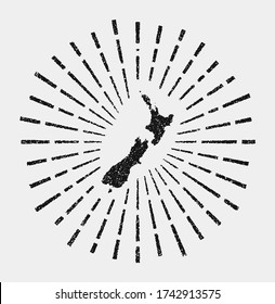 Vintage map of New Zealand. Grunge sunburst around the country. Black New Zealand shape with sun rays on white background. Vector illustration.