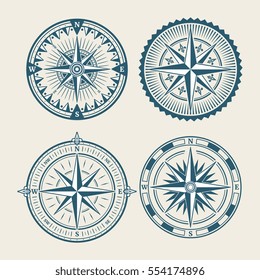 Vintage marine compass logo set. Symbol of retro win rose. Vector illustration.