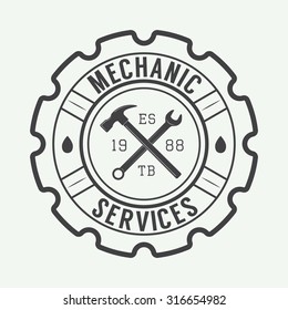 Vintage mechanic label, emblem and logo. Vector illustration