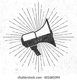 Vintage megaphone with sunburst on grunge background