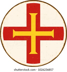 Vintage Metal Sign - Round Guernsey Flag - Vector EPS10. Grunge scratches and stain effects can be easily removed for a cleaner look.