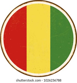 Vintage Metal Sign - Round Guinea Flag - Vector EPS10. Grunge scratches and stain effects can be easily removed for a cleaner look.