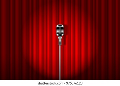 Vintage Microphone against red curtain with spotlight light backdrop