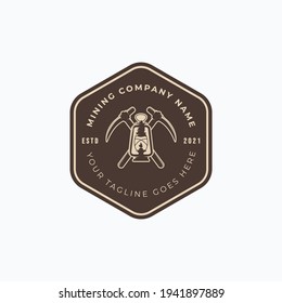 Vintage mining lantern and pickaxe logo design. vector illustration of mining lantern and pickaxe